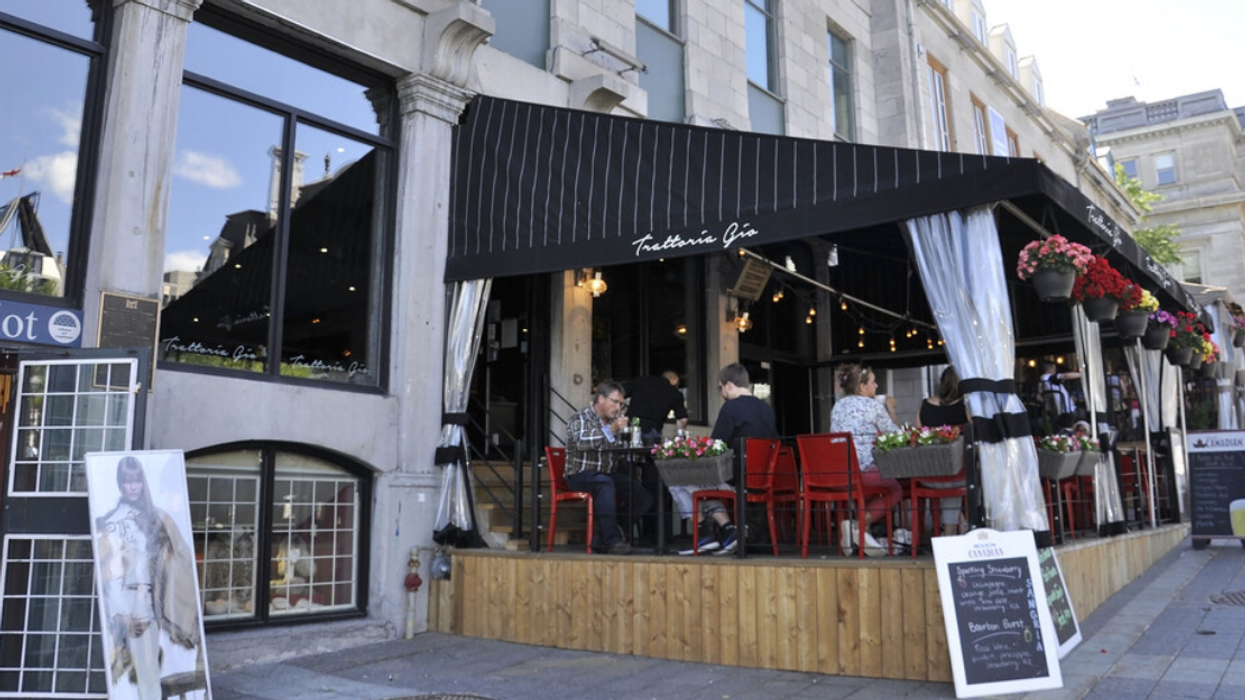 Diners eat at a Montreal restaurant, where tipping is likely expected.