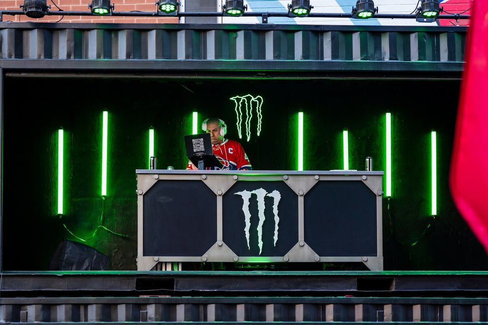 DJ performing at an outdoor Canadiens fan event in Montr\u00e9al.