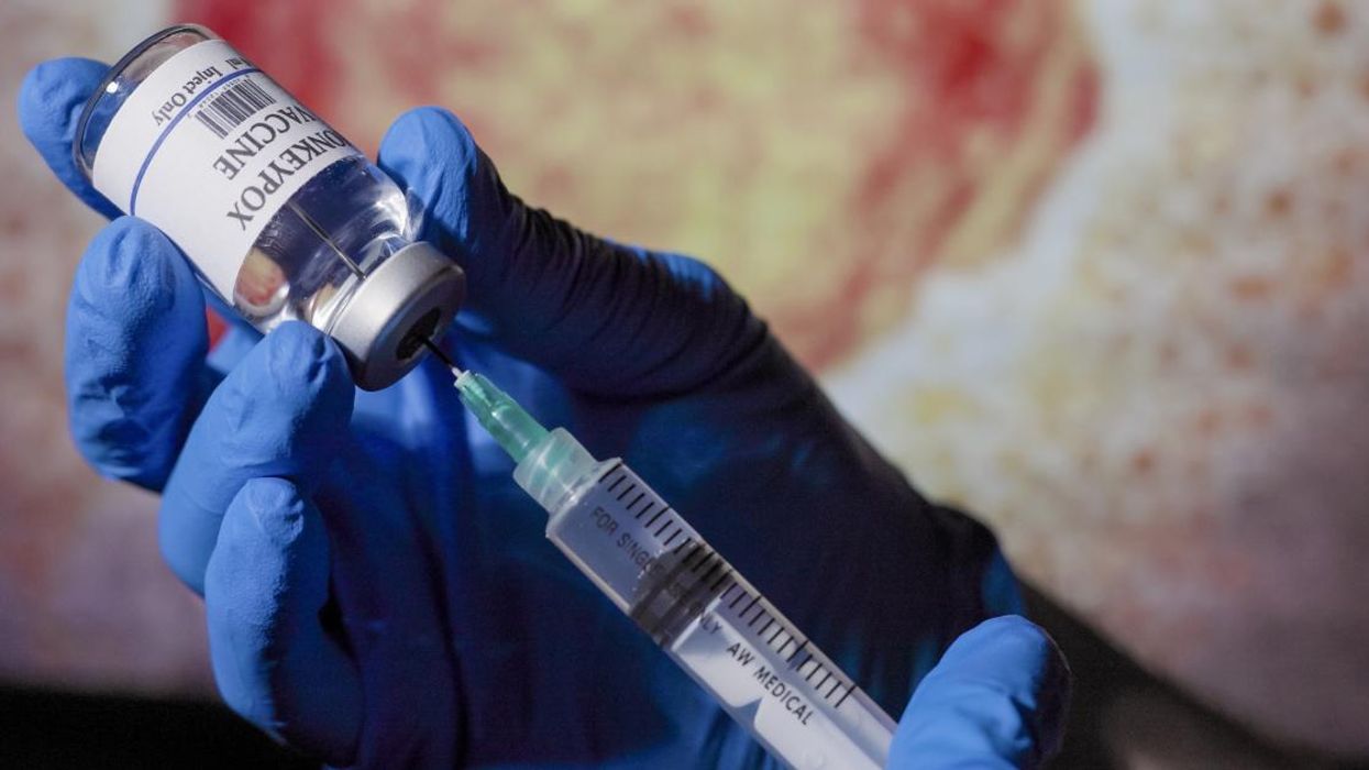 Doctor filling a syringe with monkeypox vaccine.