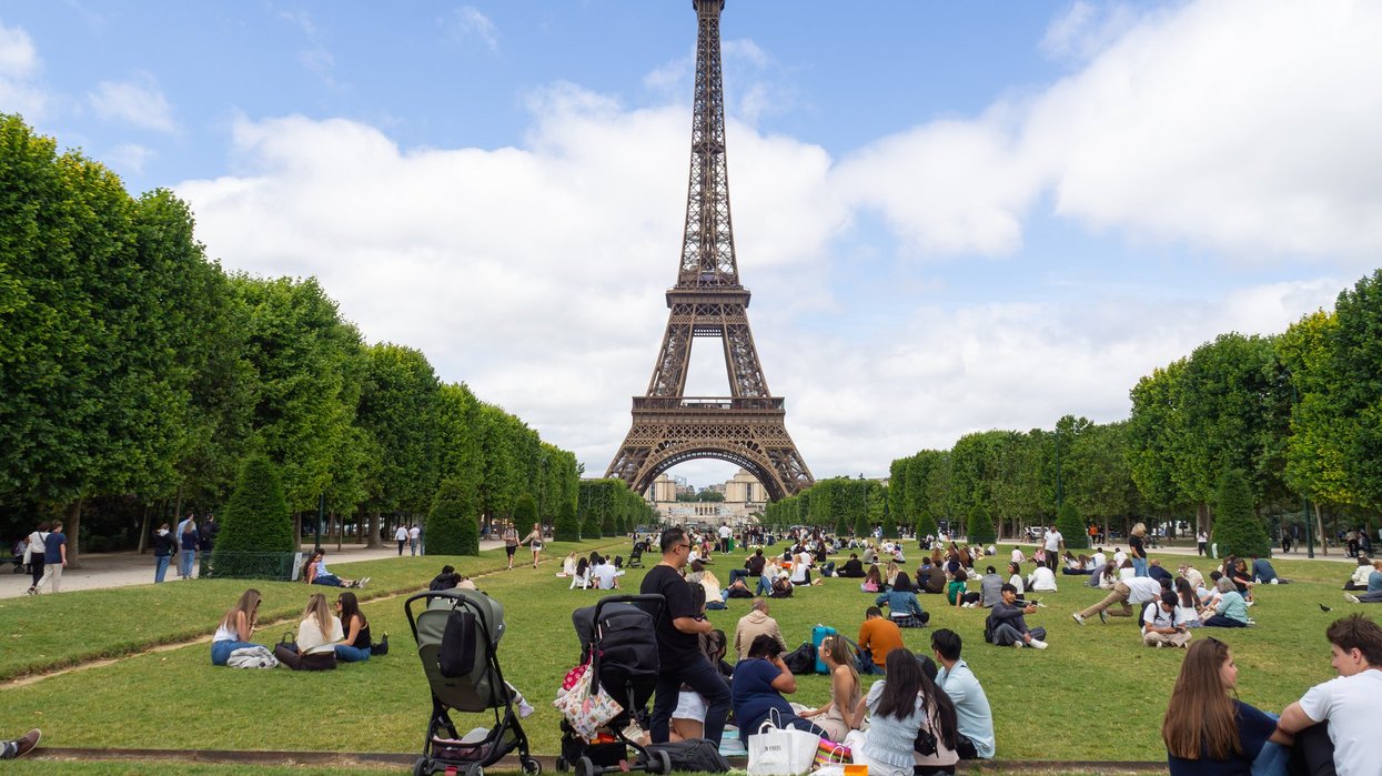 Eiffel Tower in Paris, tourists.