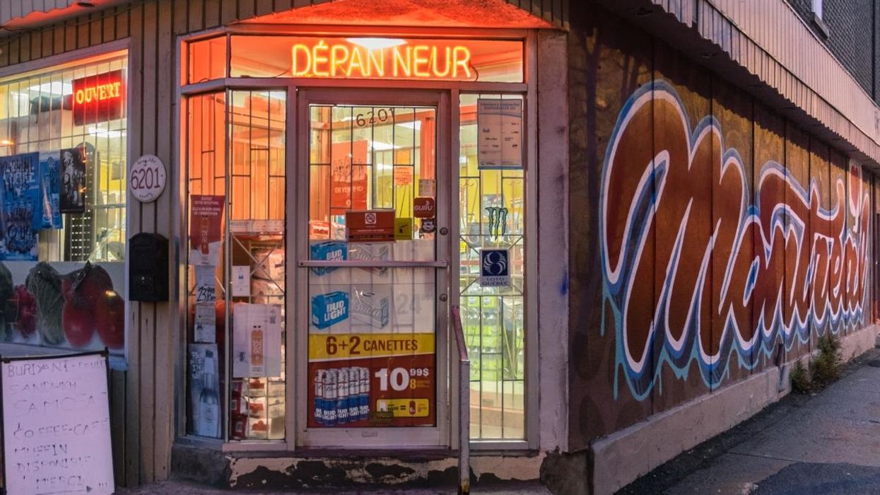 Entrance of a dépanneur in Montreal with a glimpse of famous Montreal graffiti.
