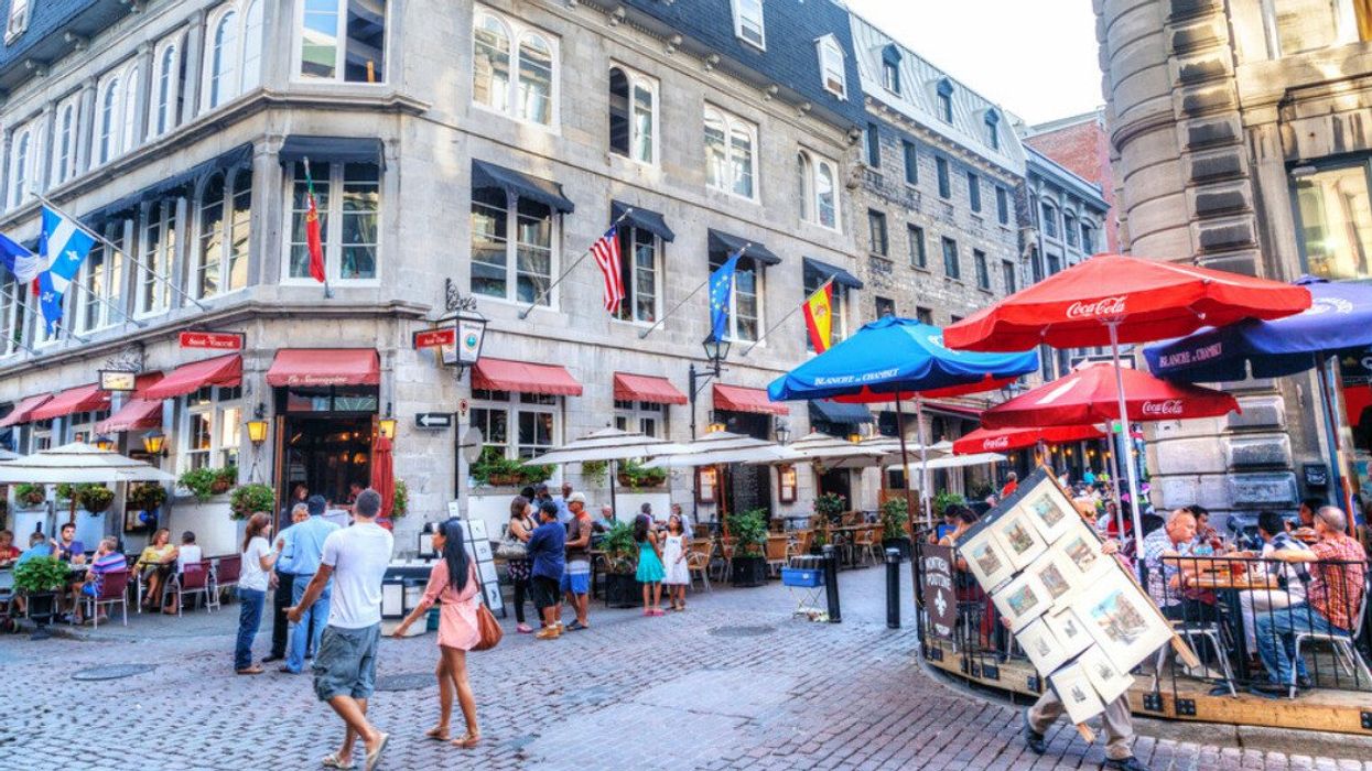 eople meander at the junction of Rue Saint-Paul and Rue Saint-Vincent in the Old Montreal section of Montreal.