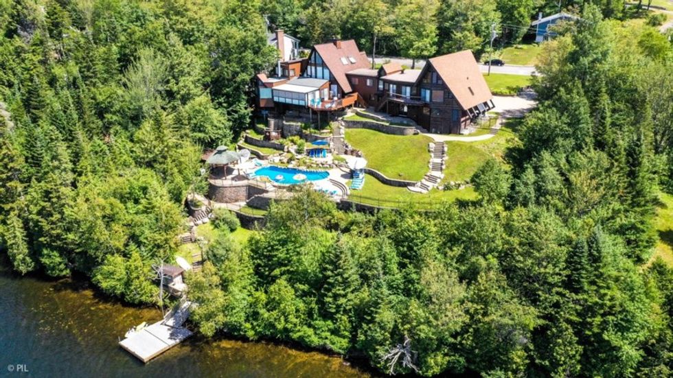 This Quebec Lake House For Sale Feels Like It's Floating Above Nature