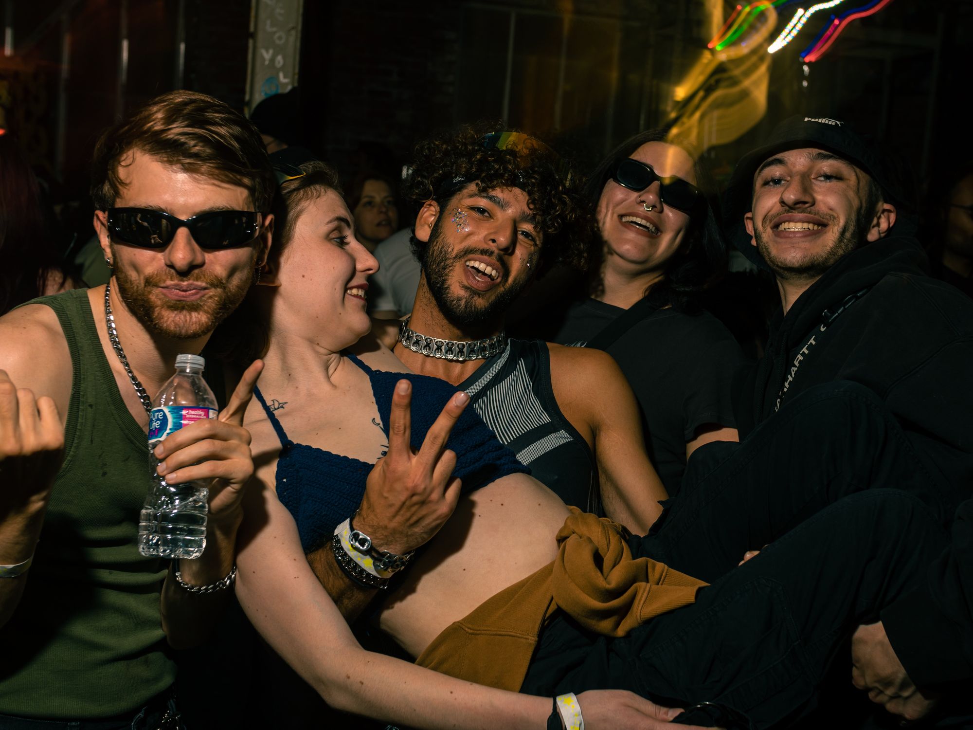 Five friends pose together.