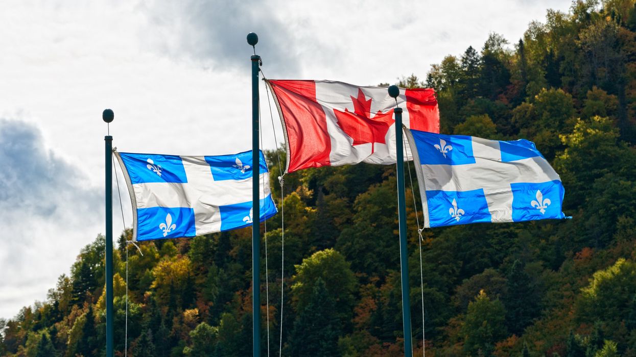 Flags of Quebec and Canada.