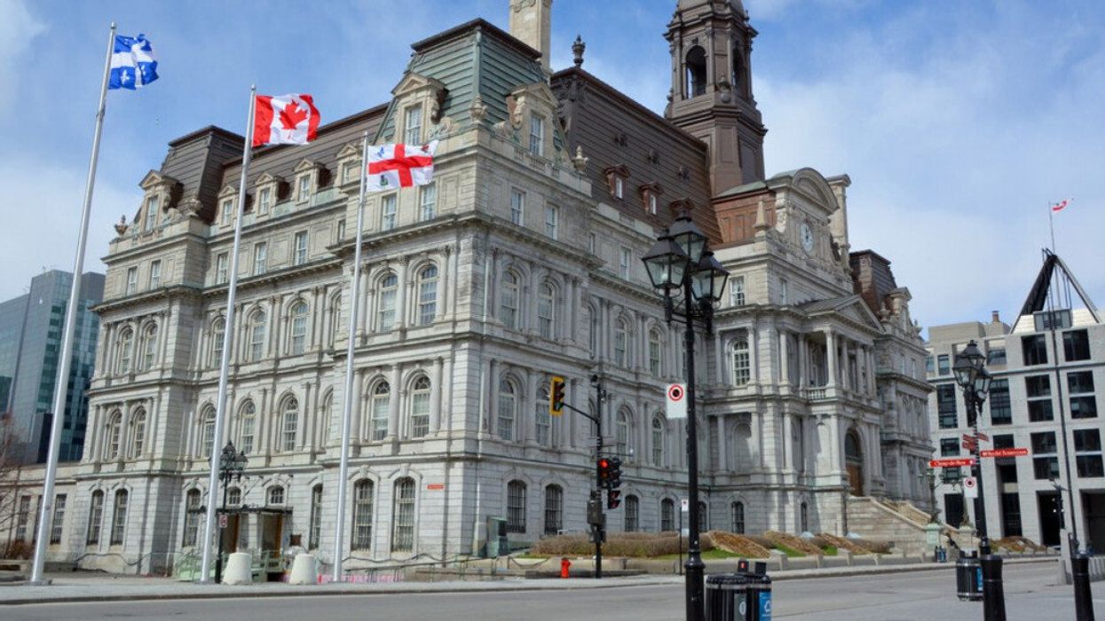 Flags wave in front of Montreal's city hall in the Old Port.