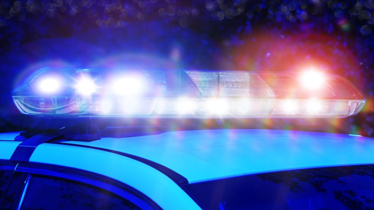 Flashing blue and red lights atop a Montreal police vehicle at night.