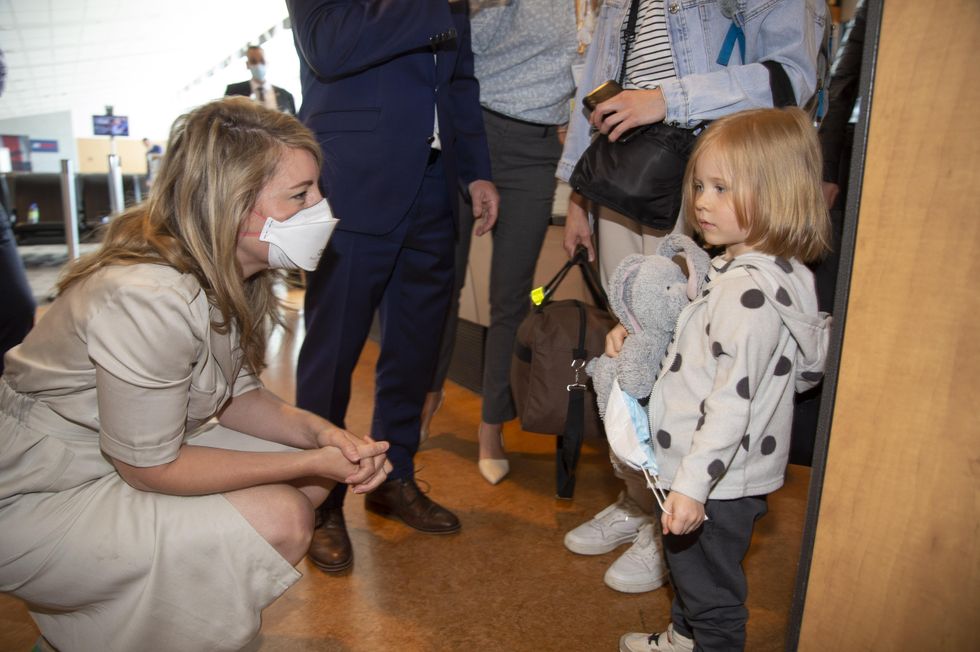 Foreign Affairs Minister M\u00e9lanie Joly greets Ukrainians arriving in Montreal.