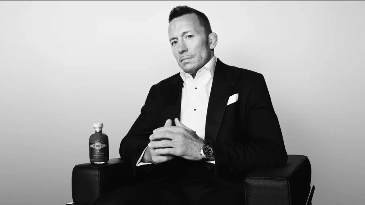 Georges St-Pierre poses with his new hot sauce.