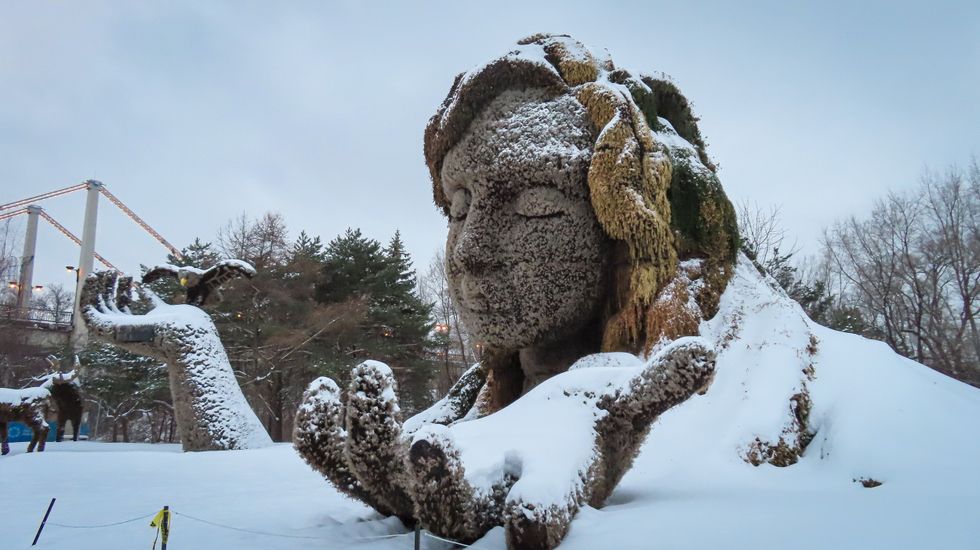 Giant Mother Earth sculpture covered in snow at Parc Jean-Drapeau Montreal.