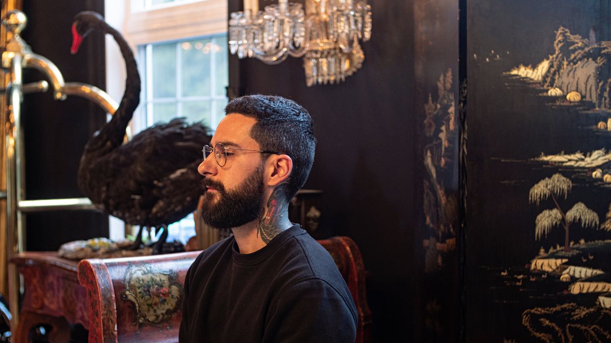 H\u00e9bert and his black swan tattoo next to the manor namesake.