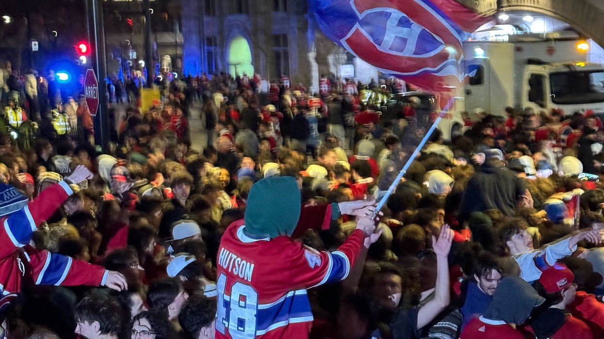 Habs fans celebrate a playoff win outside the Bell Centre.