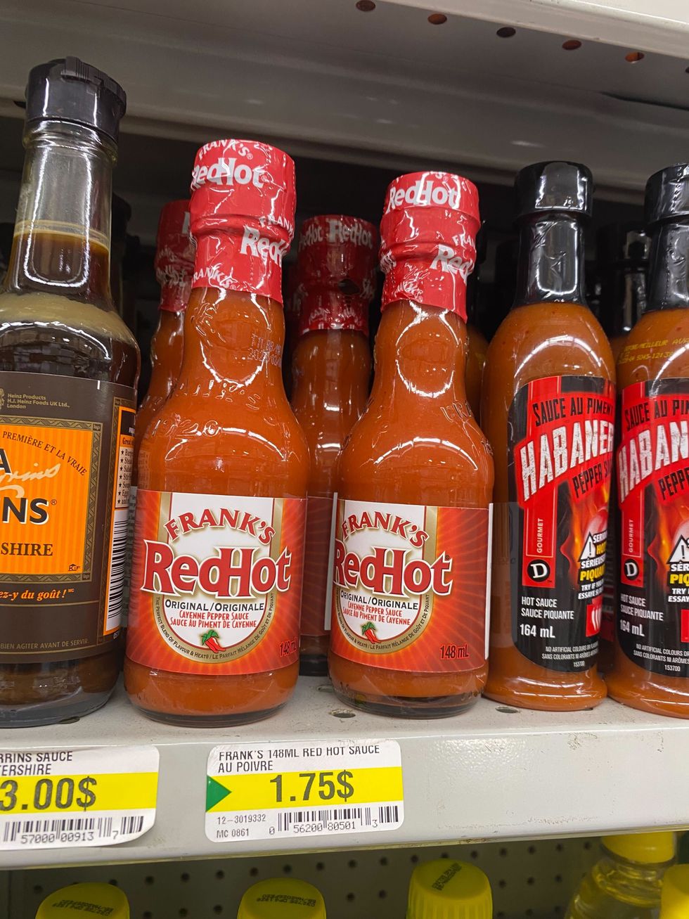 Hot sauce on a shelf at Dollarama.
