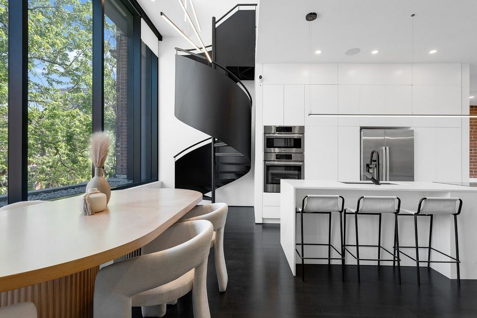 Kitchen, dining room and spiral staircase.