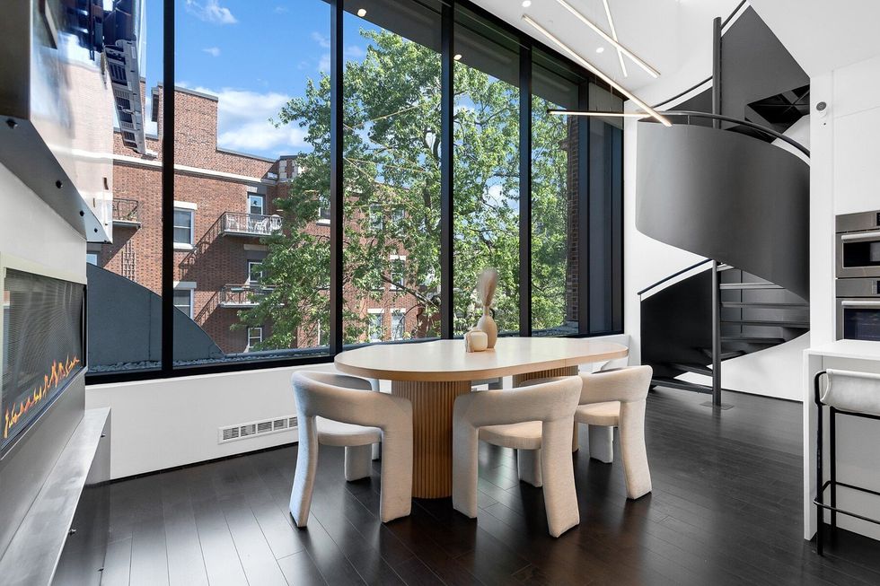 Large windows and a fireplace.