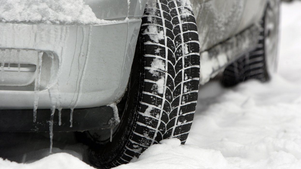 Car tires in winter season with snow.