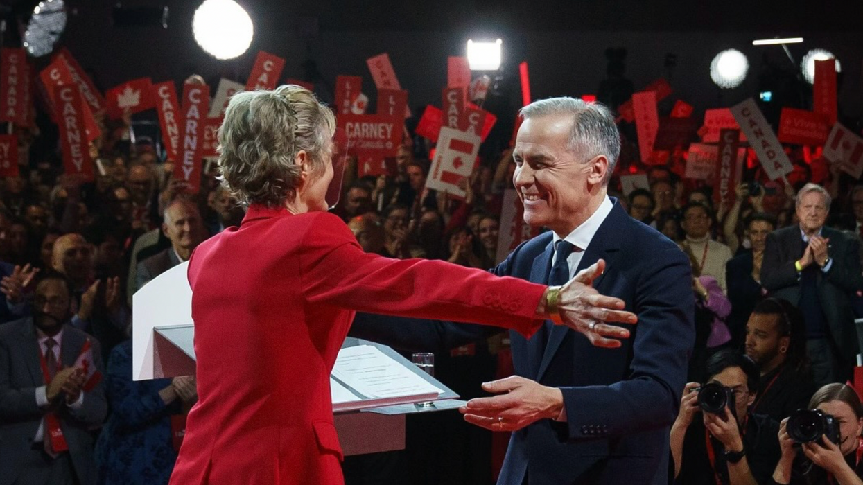 Liberal Leader Mark Carney embraces his wife after becoming party leader earlier this year.
