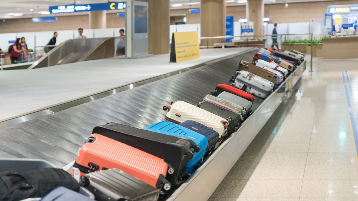 Luggage on an airport conveyor belt.
