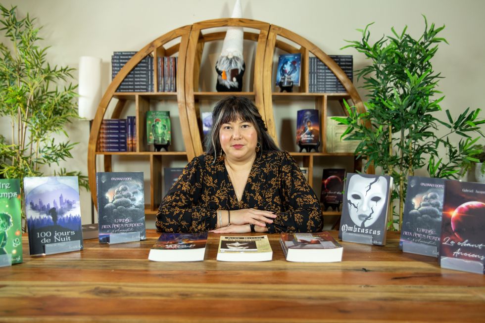 Ma\u00eflys Pailhous sits at a desk with books around her.