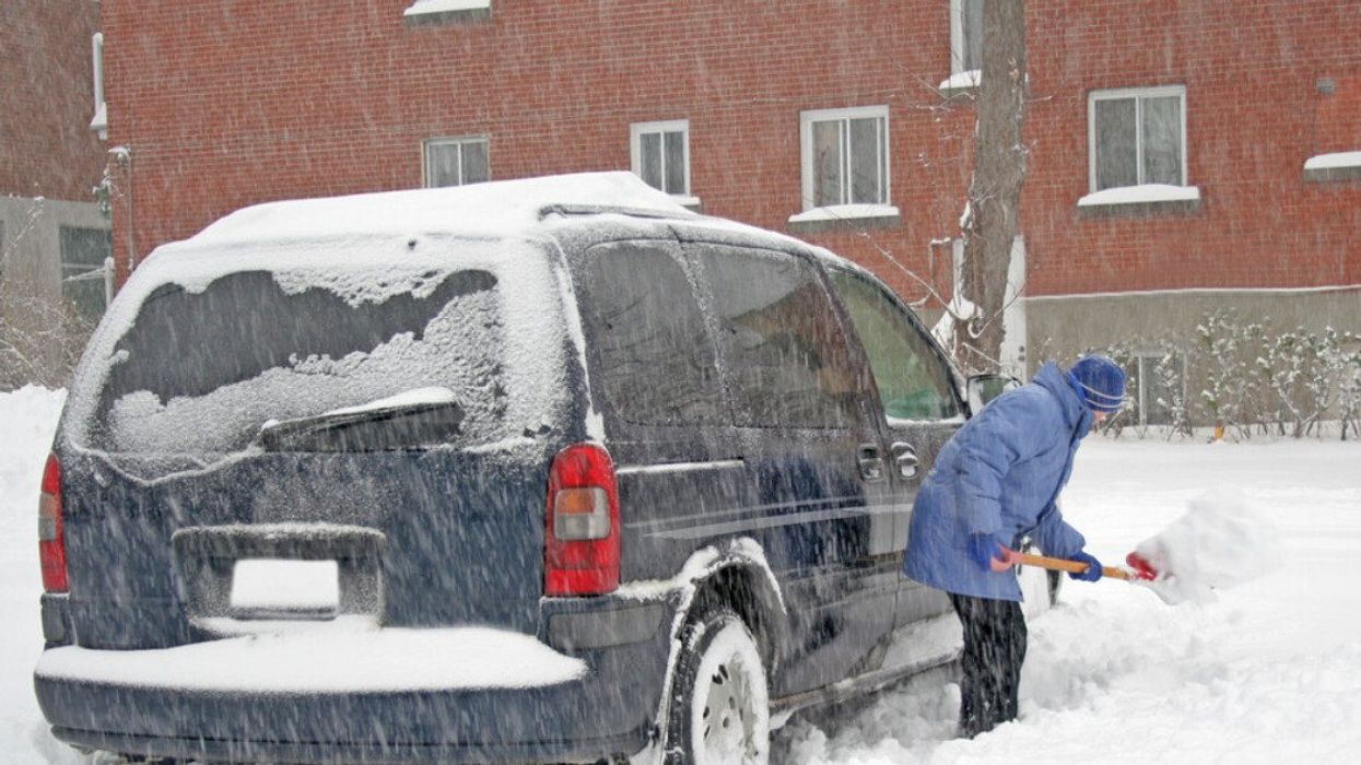 Man shoveling after a snow storm. Montreal.