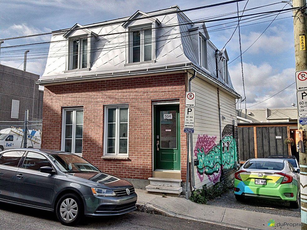 Mansard-roof townhouse for sale in Quebec City.