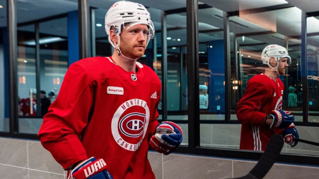 Mike Matheson in full hockey gear sporting a red Montreal Canadiens jersey.