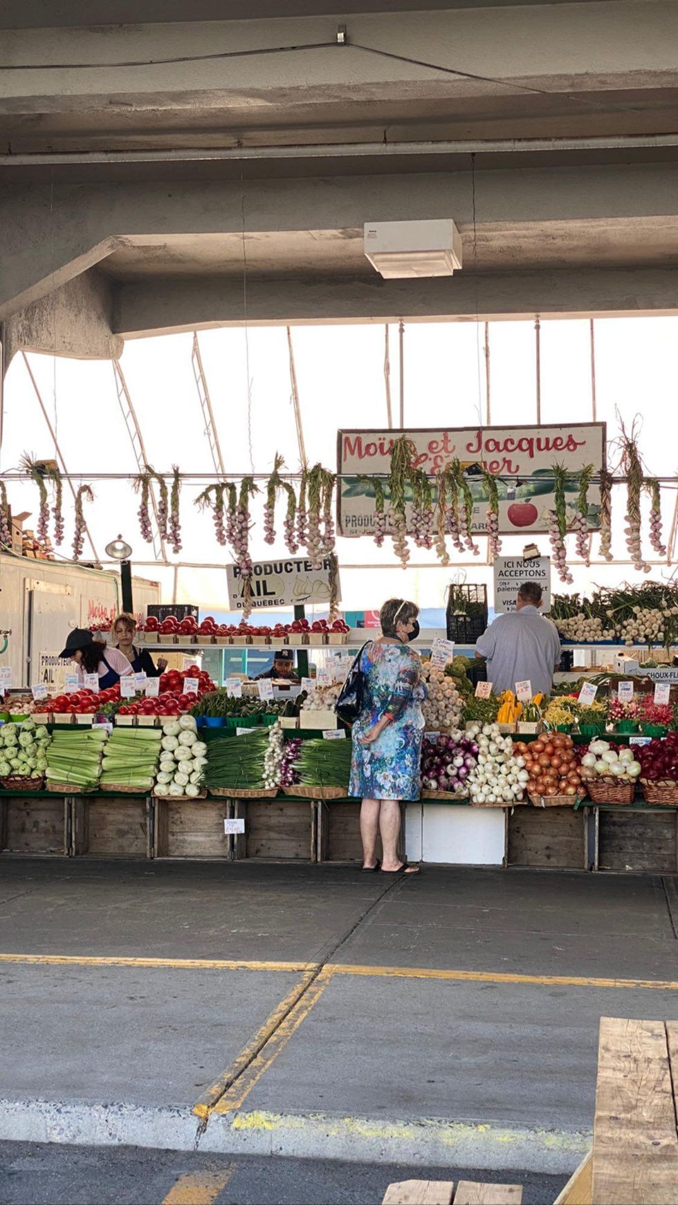 Mo\u00efse et Jacques L'\u00c9cuyer stand at Montreal's Jean-Talon Market.