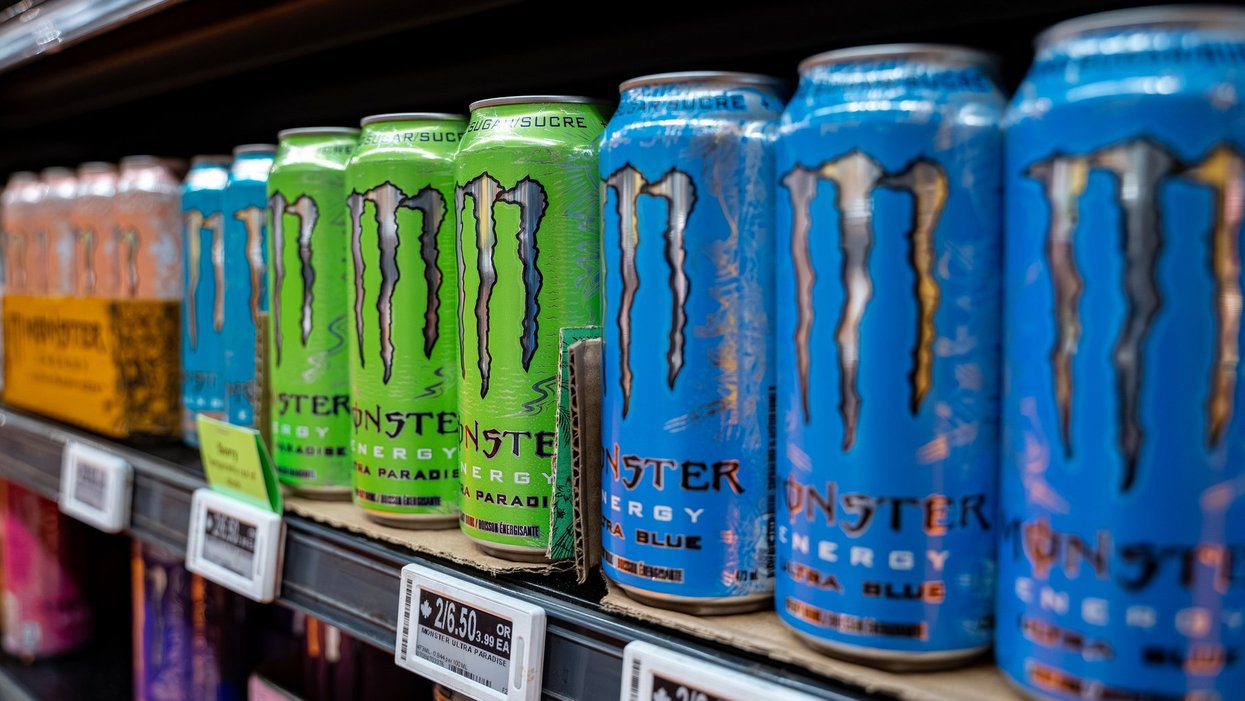 Monster energy drinks on a shelf.