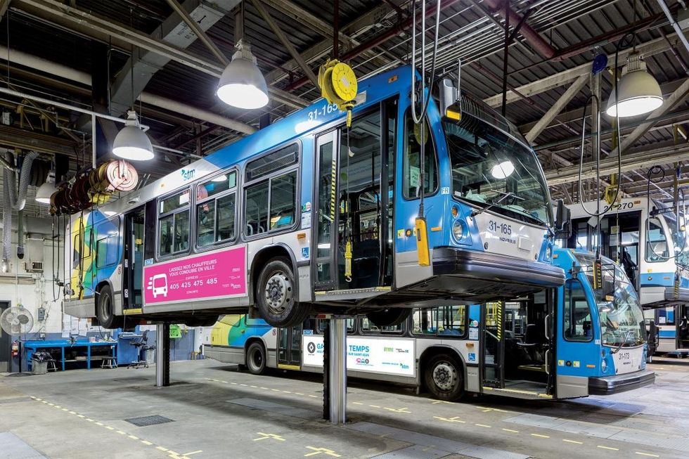 Montreal buses being serviced at the STM maintenance centre.