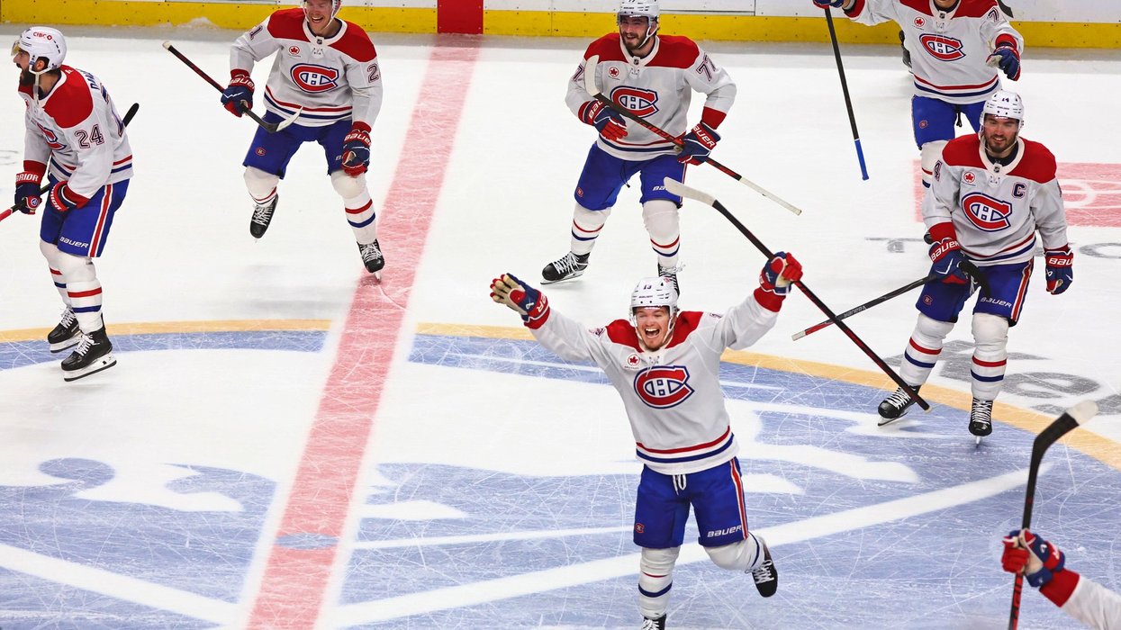 Montreal Canadiens players celebrate on the ice following their overtime win on Monday.