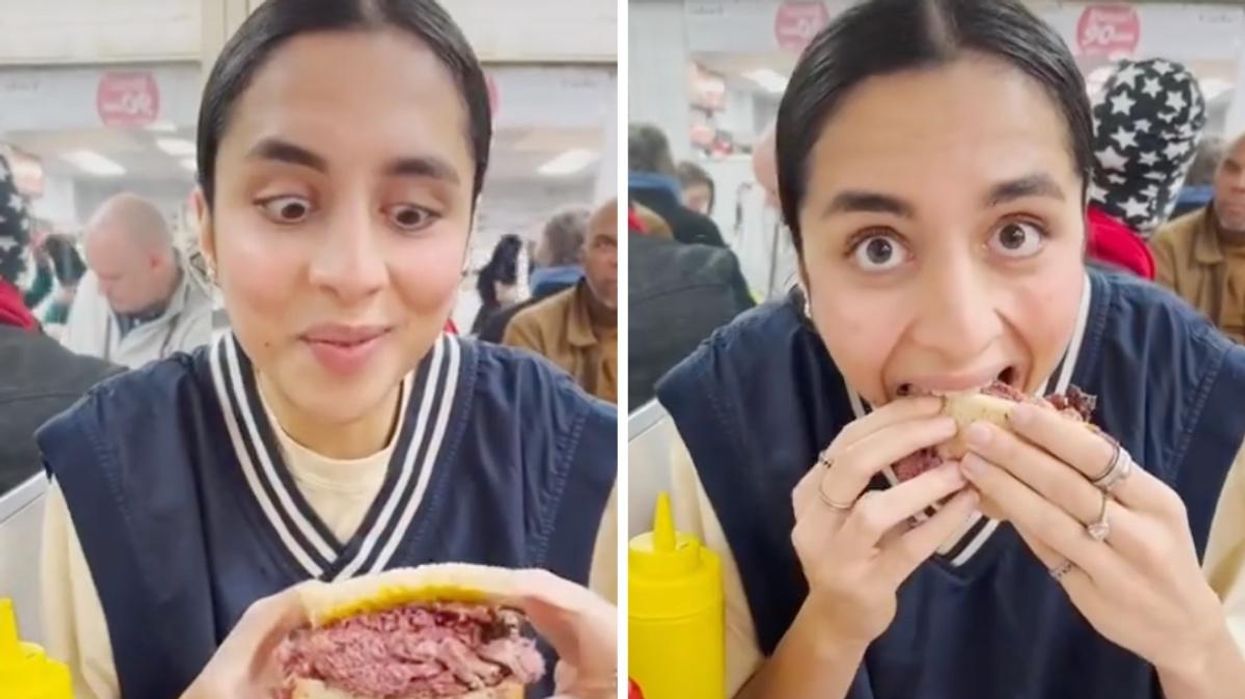 Montreal food blogger Deeva trying a Montreal-style smoked meat sandwich for the very first time.