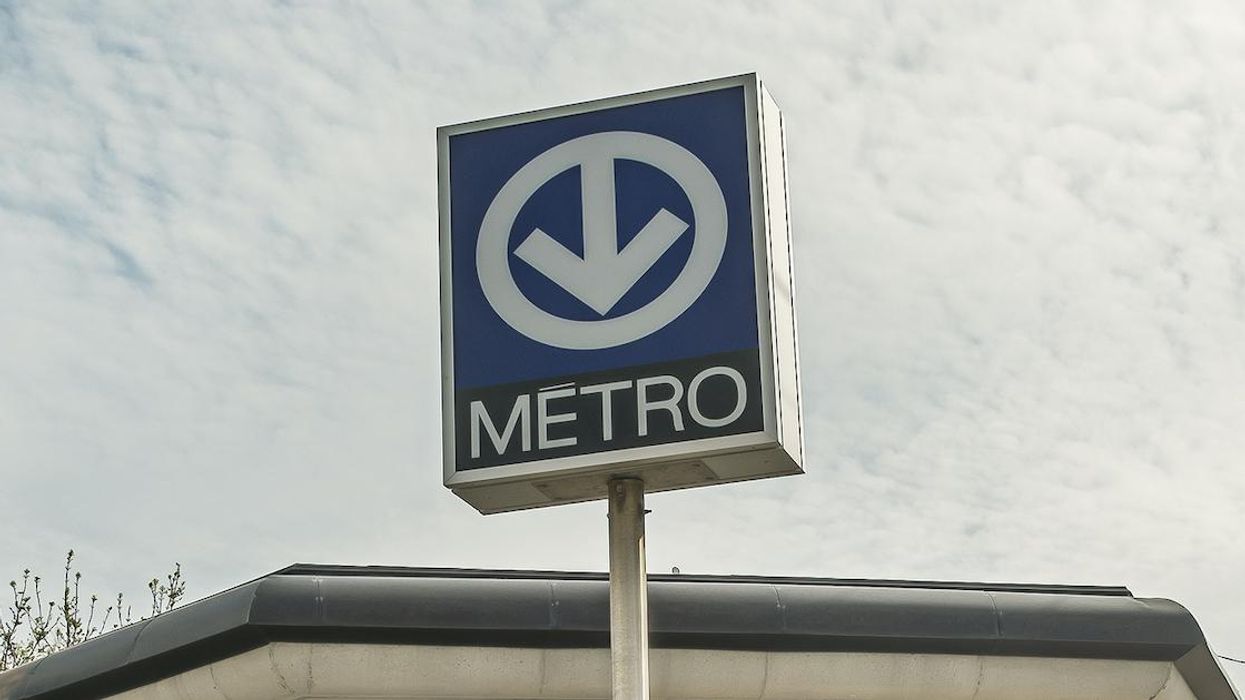Montreal metro sign outside Fabre station on the Blue line in spring.