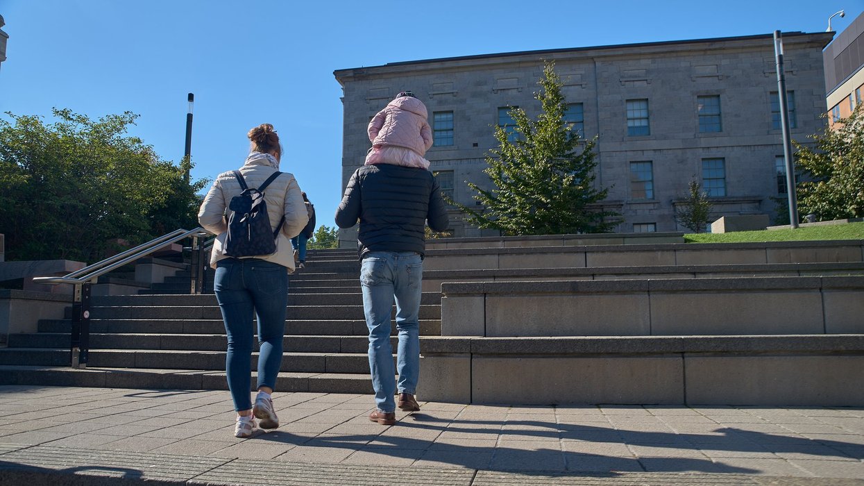 Montreal, Quebec, Canada September 14, 2018: McGill Campus - State Research University in English. A young family walks in the courtyard of the university.