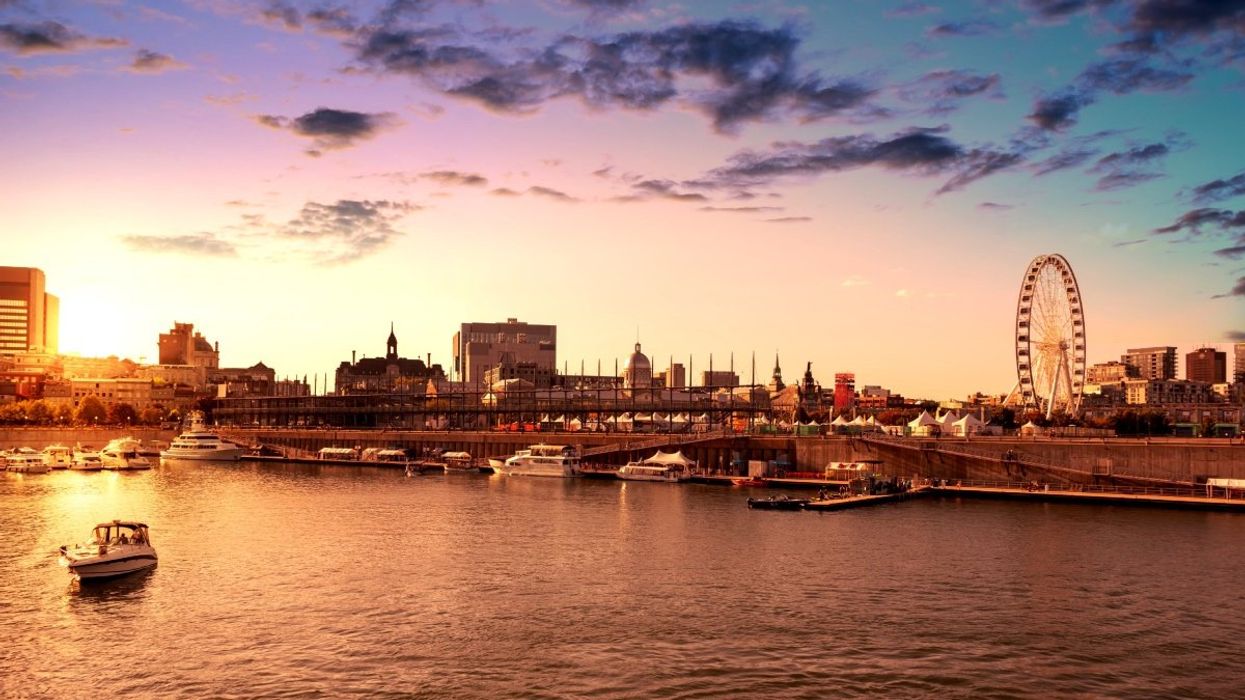 Montreal's Old Port during the sunset with views of the skyline, boats and the Grand Roue.
