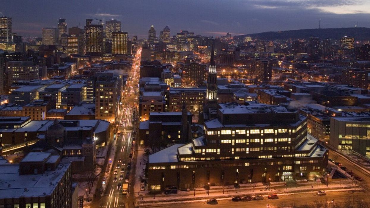Montreal's snow-coated skyline with downtown and Mount Royal on the horizon.