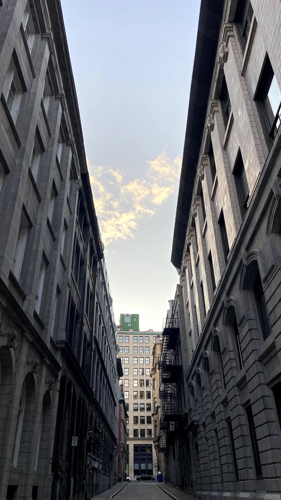 Narrow alleyway next to Old Montreal's Corn Exchange building.