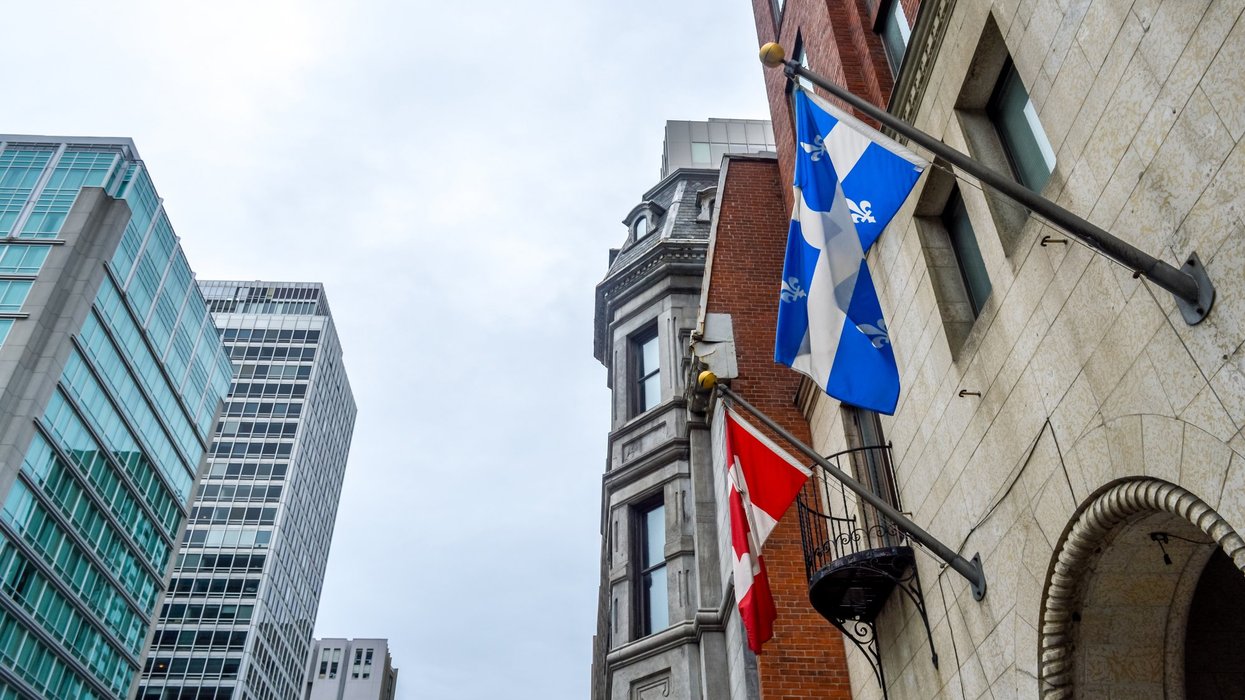 National and Quebec flags on display in Montreal.