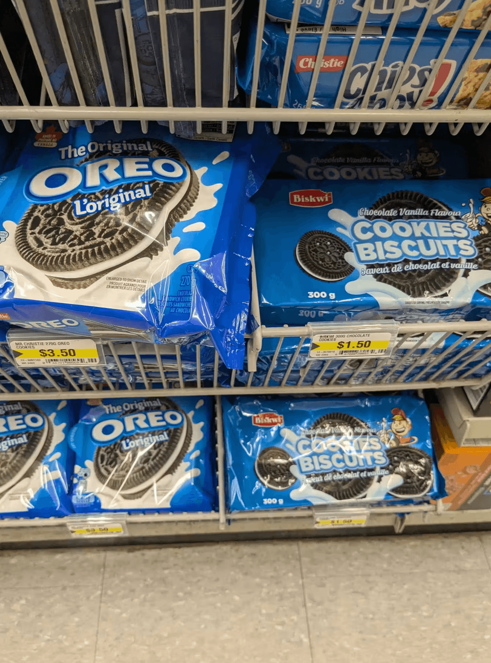 Oreo cookies next to Biskwi chocolate vanilla knock-off cookies at Dollarama priced at $1.50.