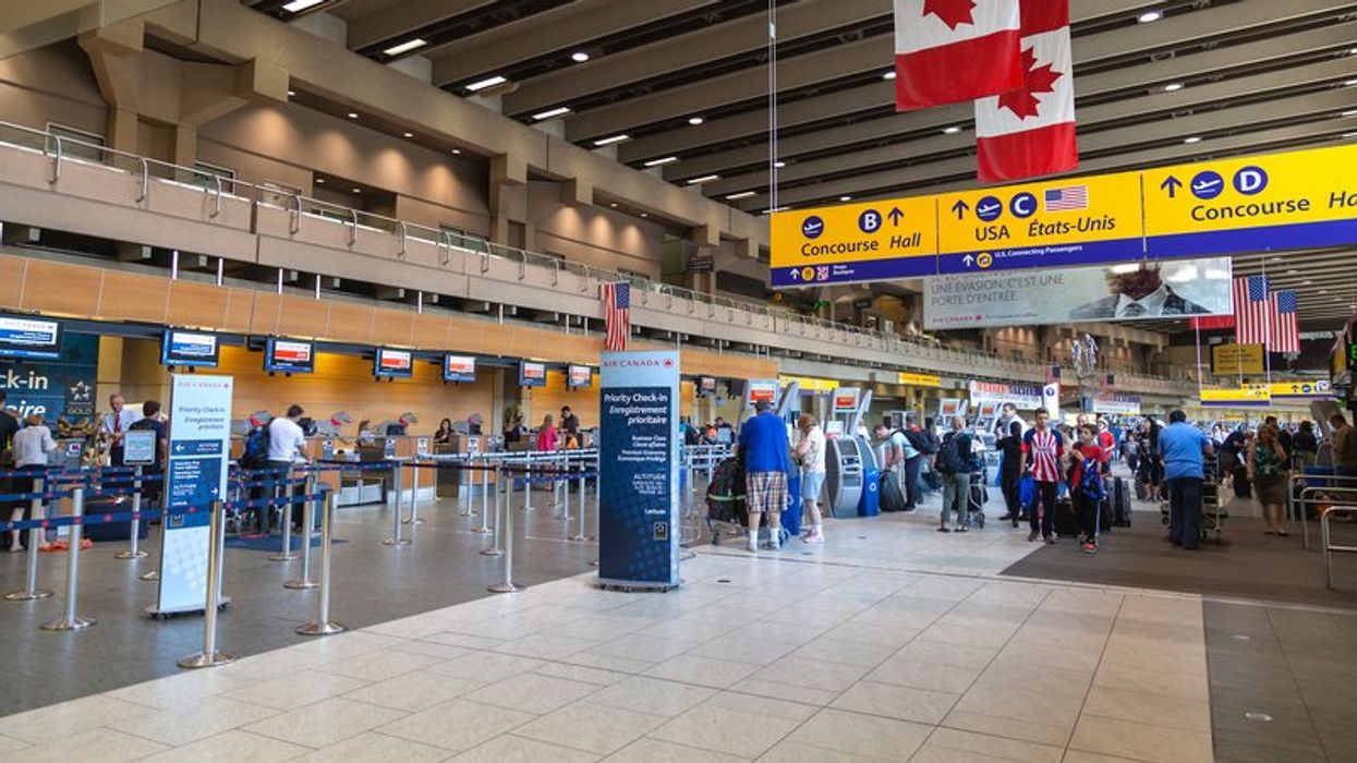 Passengers at a Calgary International Airport terminal.