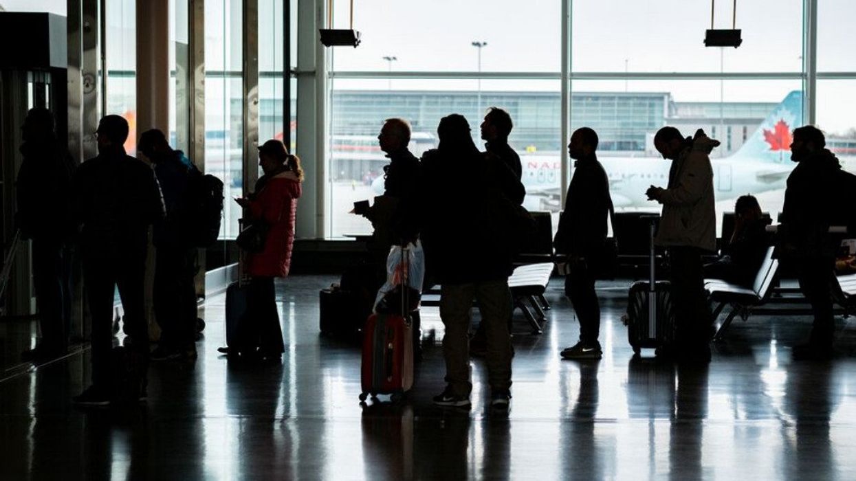 Passengers Waiting in Line for Their Flights in Pierre-Eliot Trudeau Airport.