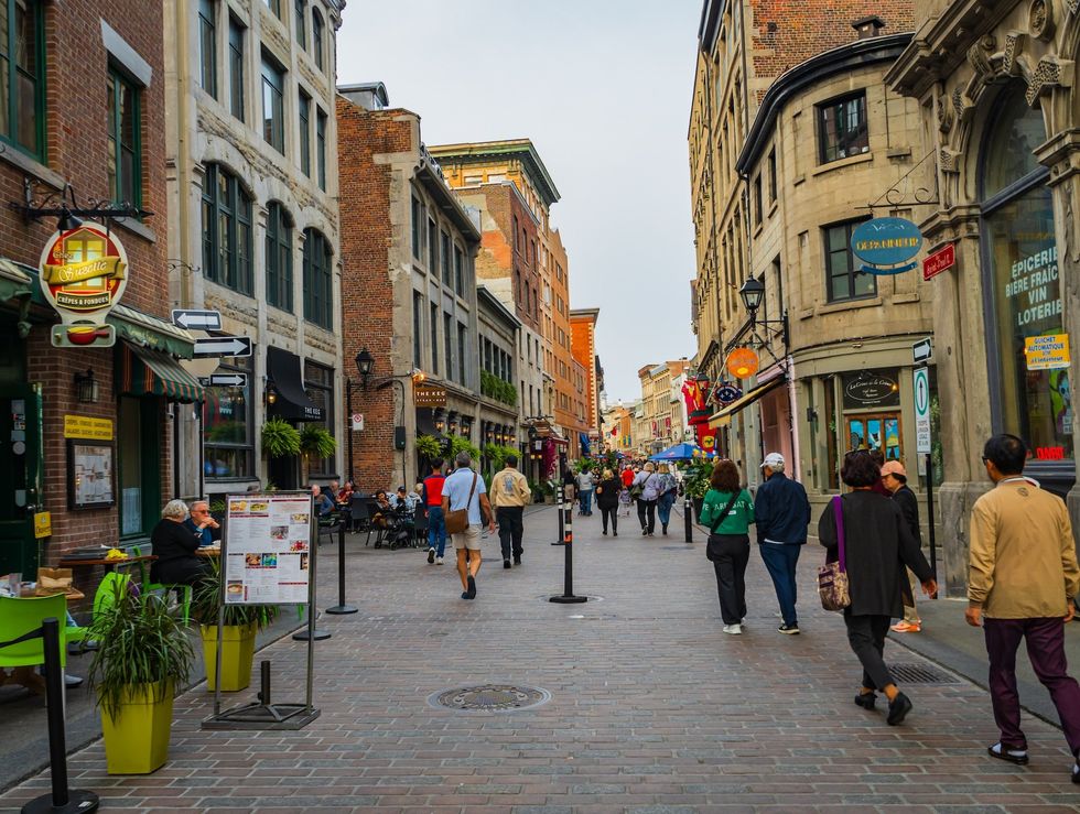 Pedestrians on rue Saint-Paul in Old Montreal on a fall day.