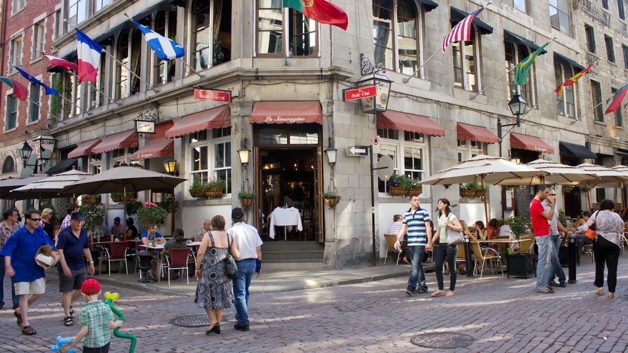Pedestrians walk on rue Saint-Paul in Old Montreal.