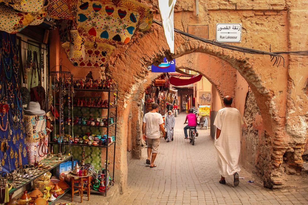 People and shops in the Marrakesh souk.