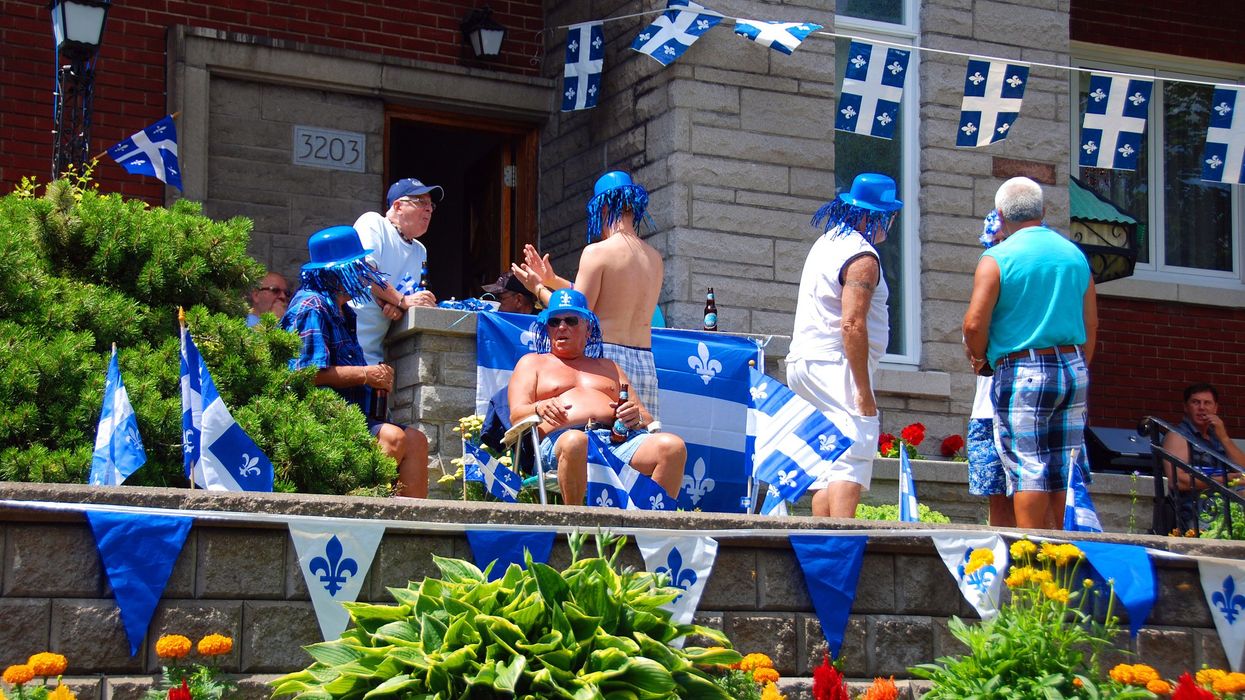people celebrating Quebec`s National Holiday French: La Fete nationale du Quebec is celebrated annually on June 24.