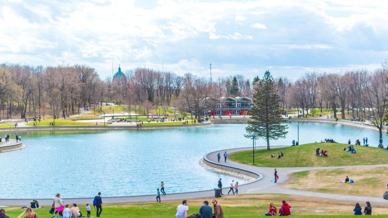 People enjoy a spring day on Mount Royal in Montreal.