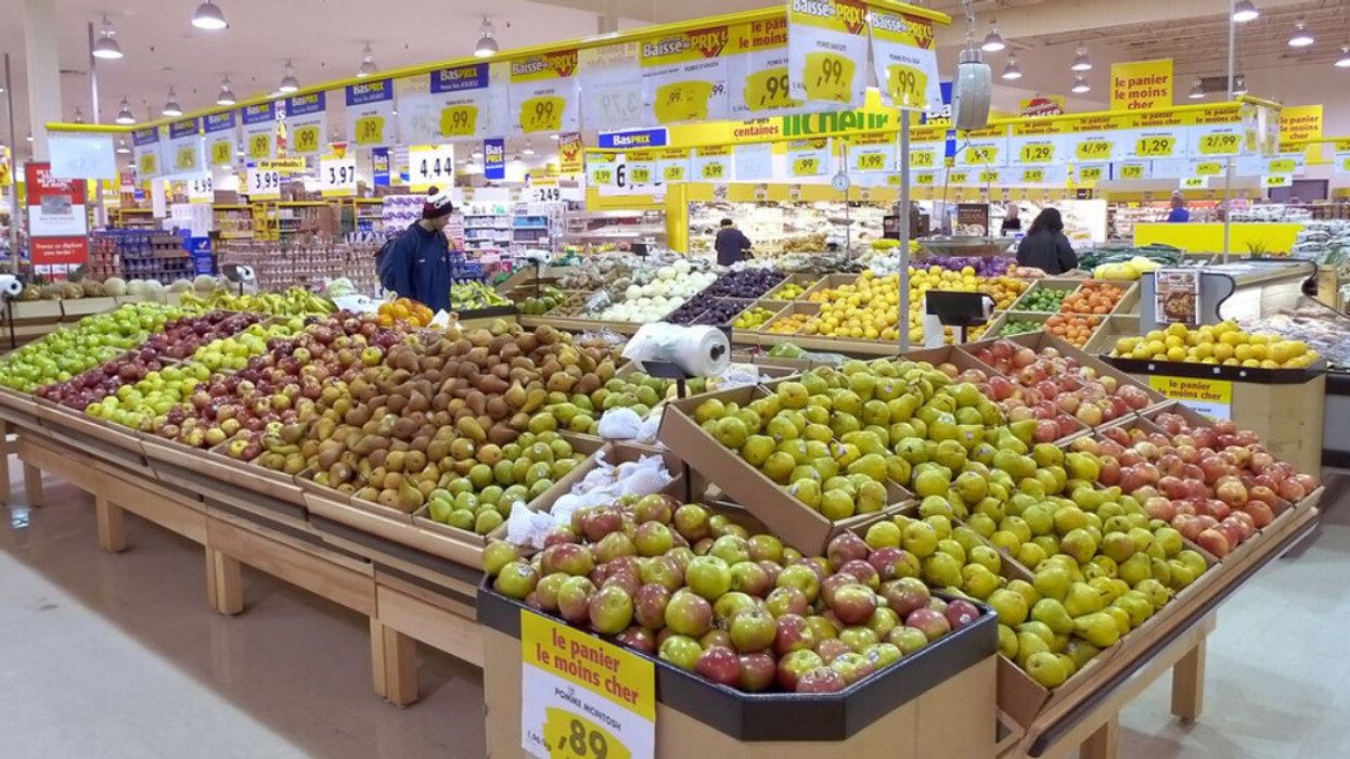 People in the produce section of a Maxi in Montreal.
