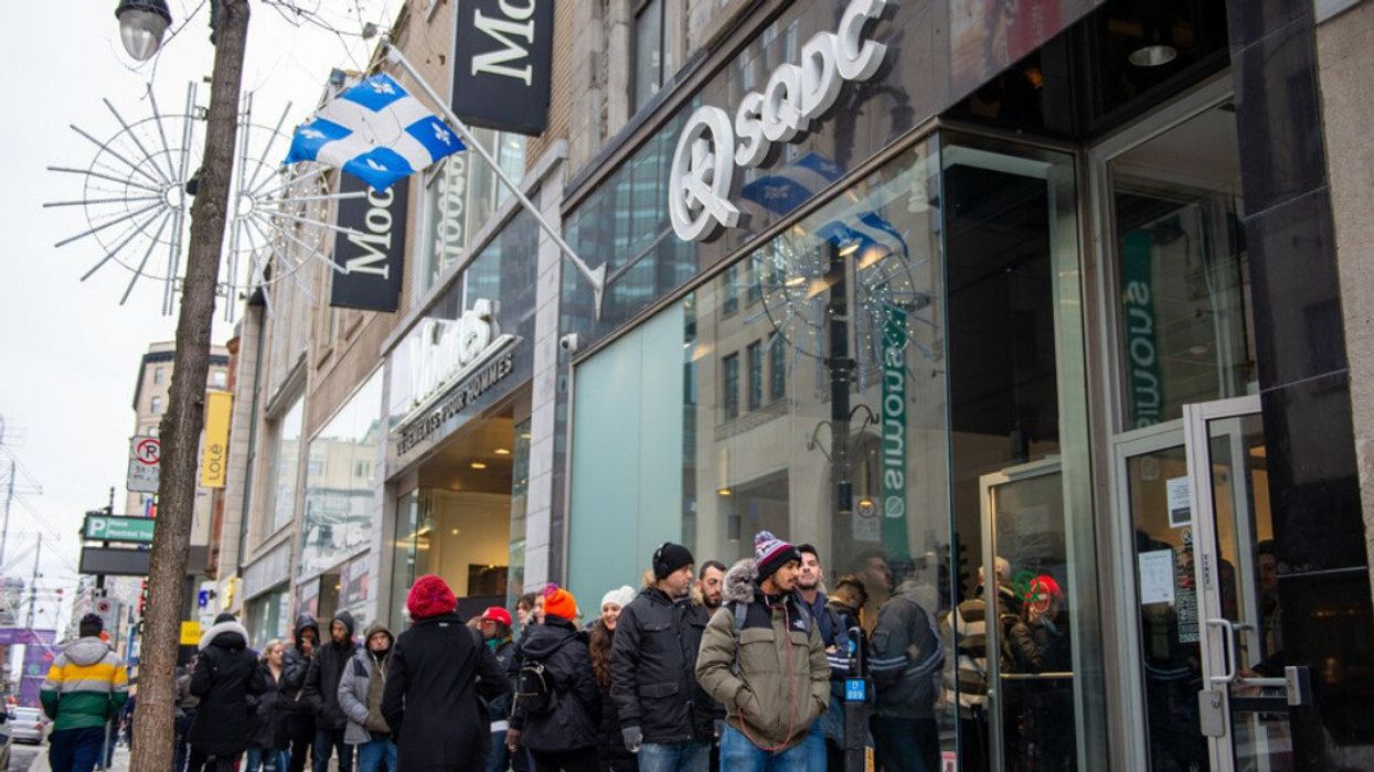 People line up outside an SQDC in Montreal, Quebec.