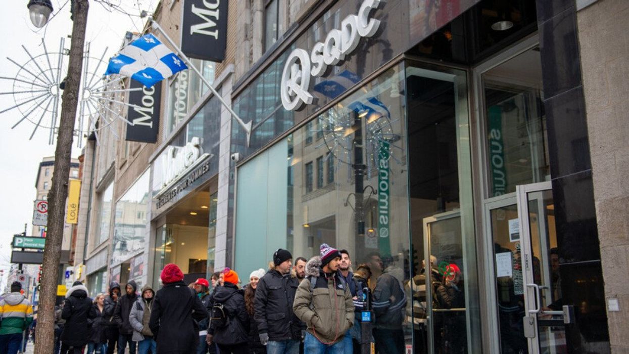 People line up outside an SQDC in Montreal.