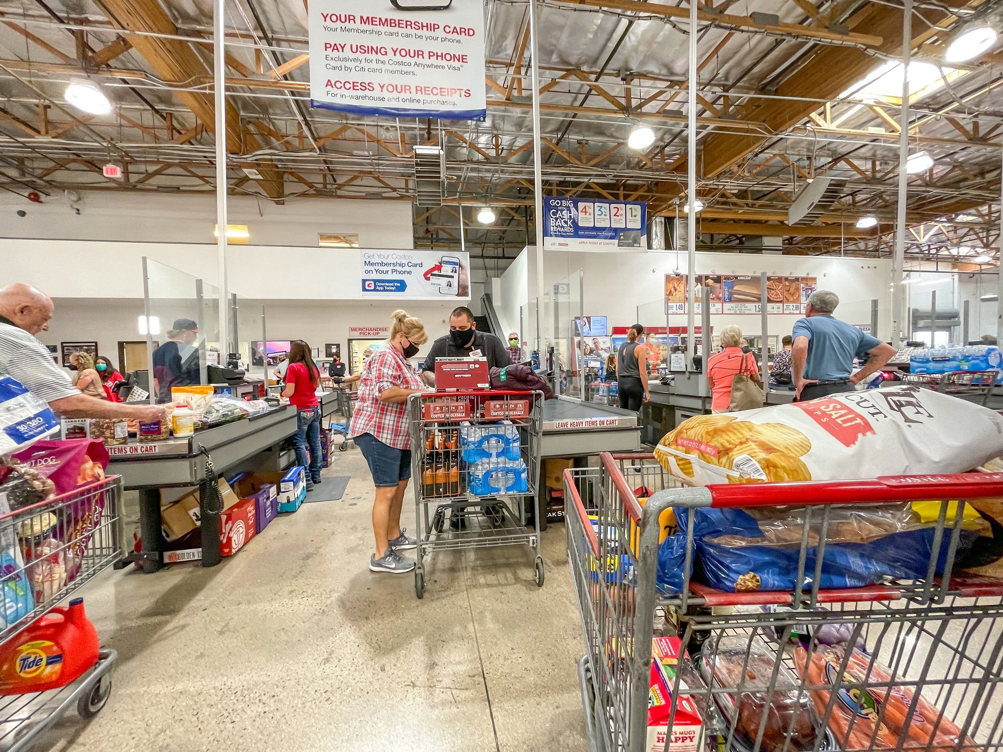 People line up to pay at Costco Wholesale.
