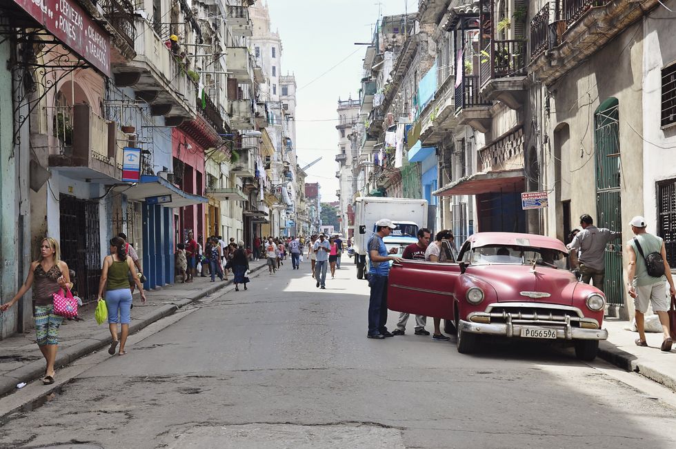 People on a street in Old Havana, Cuba.